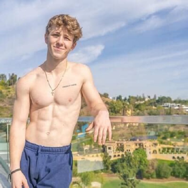 Ethan Wacker posing for the photo showing his sixpacks