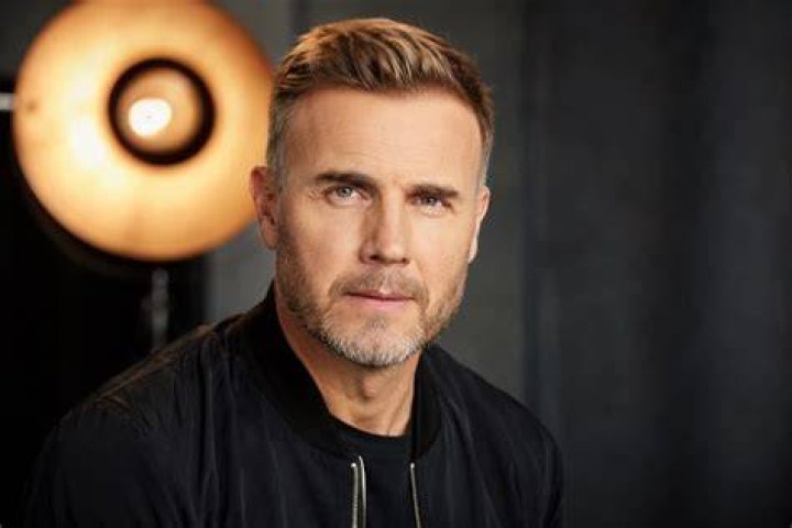 Gary Barlow Net Worth- Wth His Wife (Source: Hello Magazine)