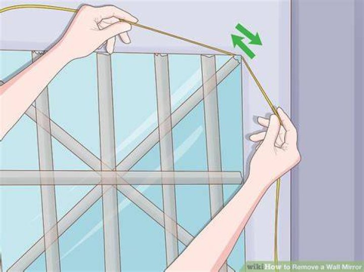 How do you remove mirror tiles from a wall?