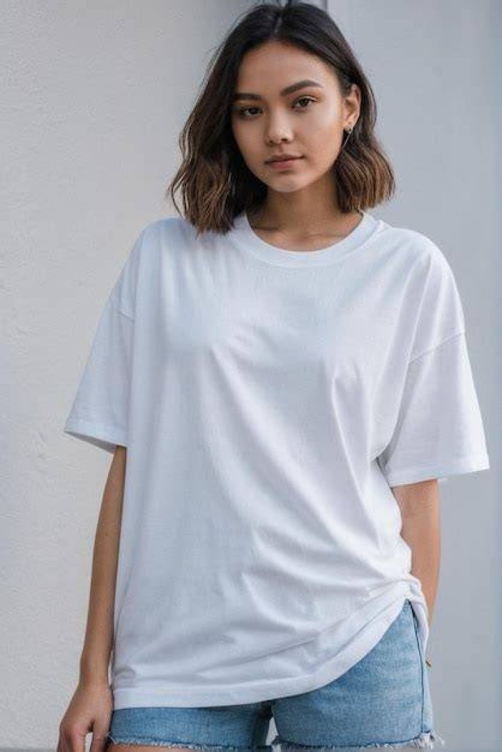 Jentzen wearing a white t-shirt and his girlfriend is wearing cream color dress.