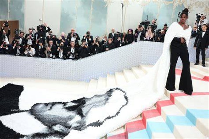 Jeremy Pope slayed in a 33 foot train featuring Karl Lagerfeld’s face at the Met Gala