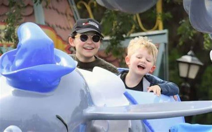 Oliver Finlay Dallas in a blue jacket with his father in a grey shirt.