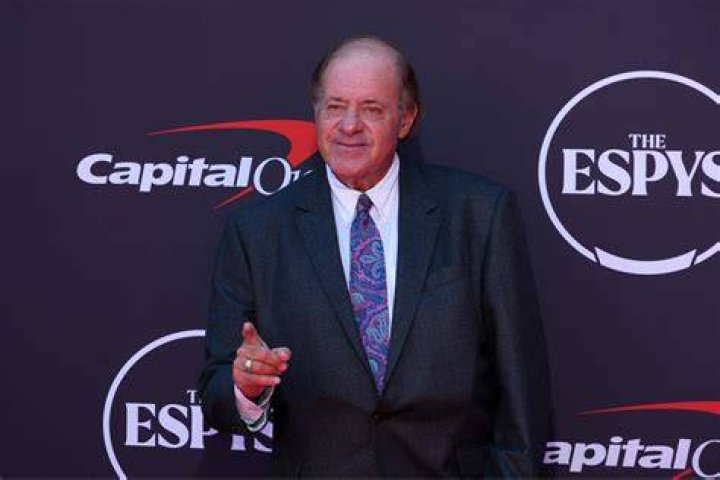 Sports anchor Chris Berman (C) and his family pose for photographers during installation ceremony honoring him with a star on the Hollywood Walk of Fame on May 24, 2010 in Hollywood, California.